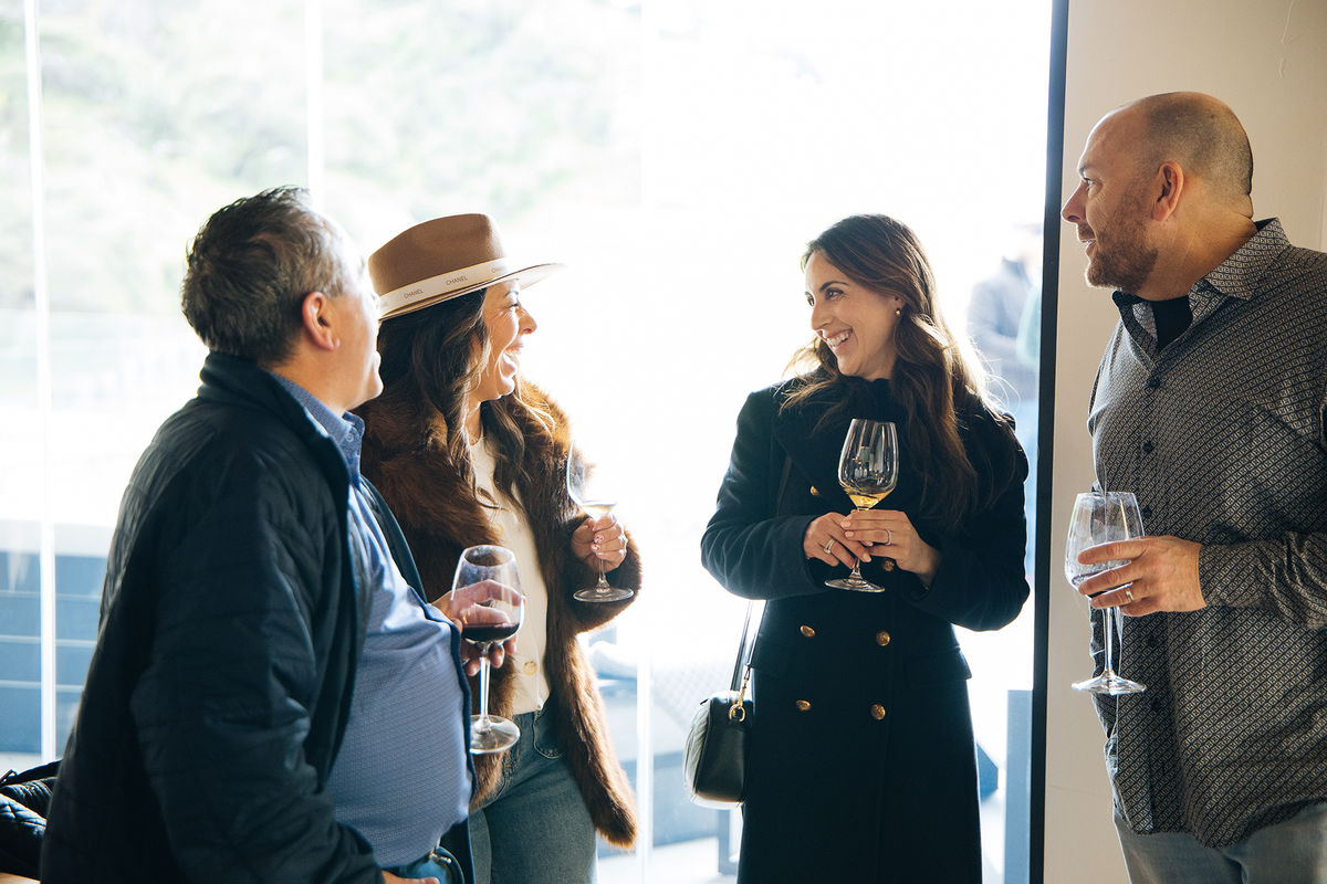 Guests enjoying wine together at Skipstone